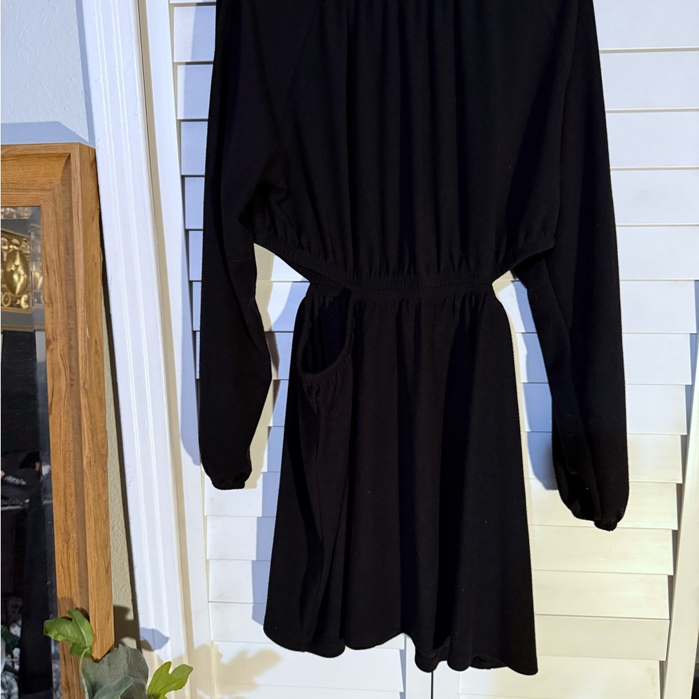 Black sweater dress with side cutouts